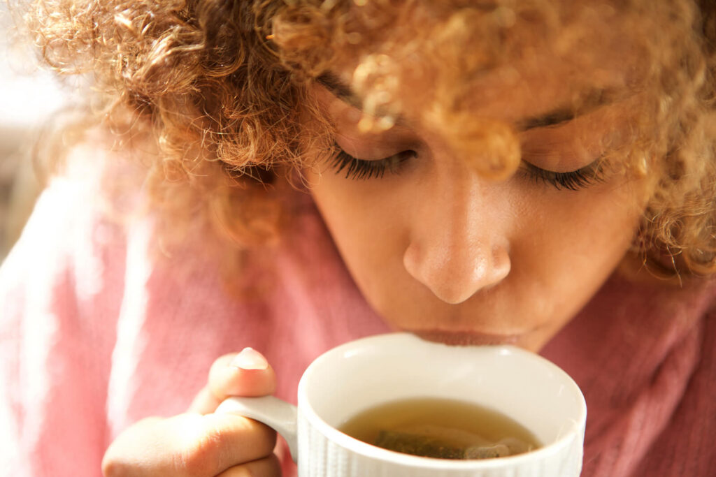 woman drinking tea - what is Joshanda tea