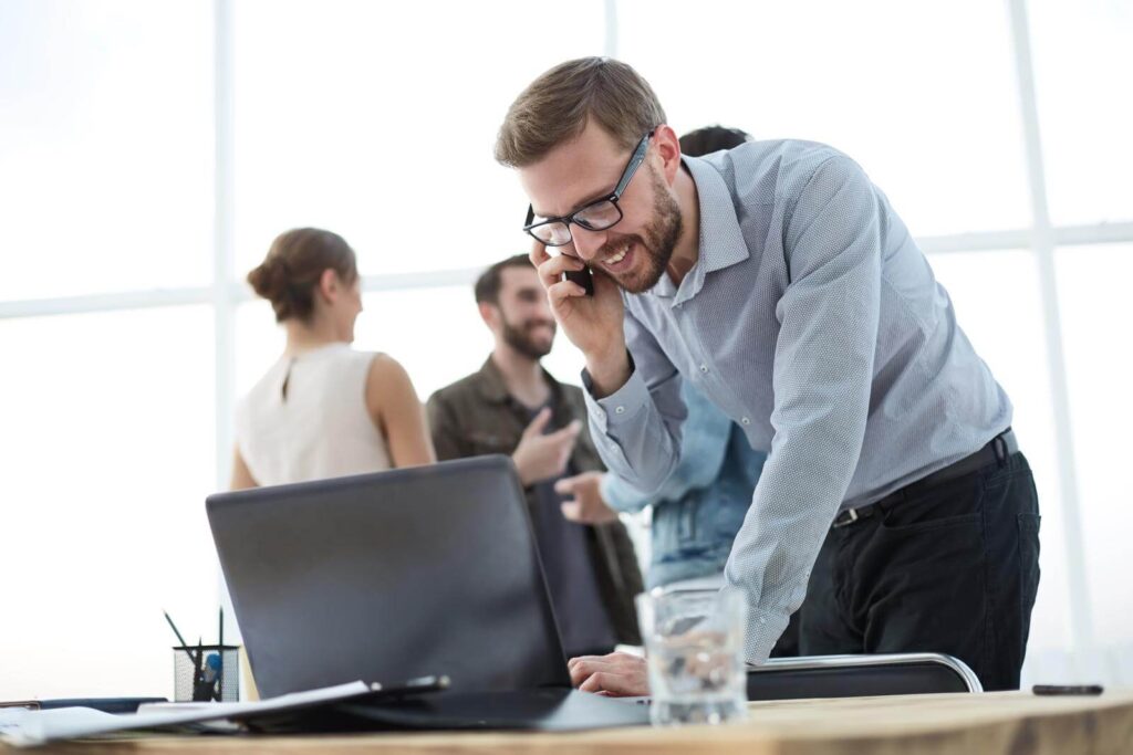 modern business man using laptop and smartphone