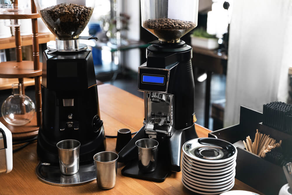 Modern coffee grinding machines in display