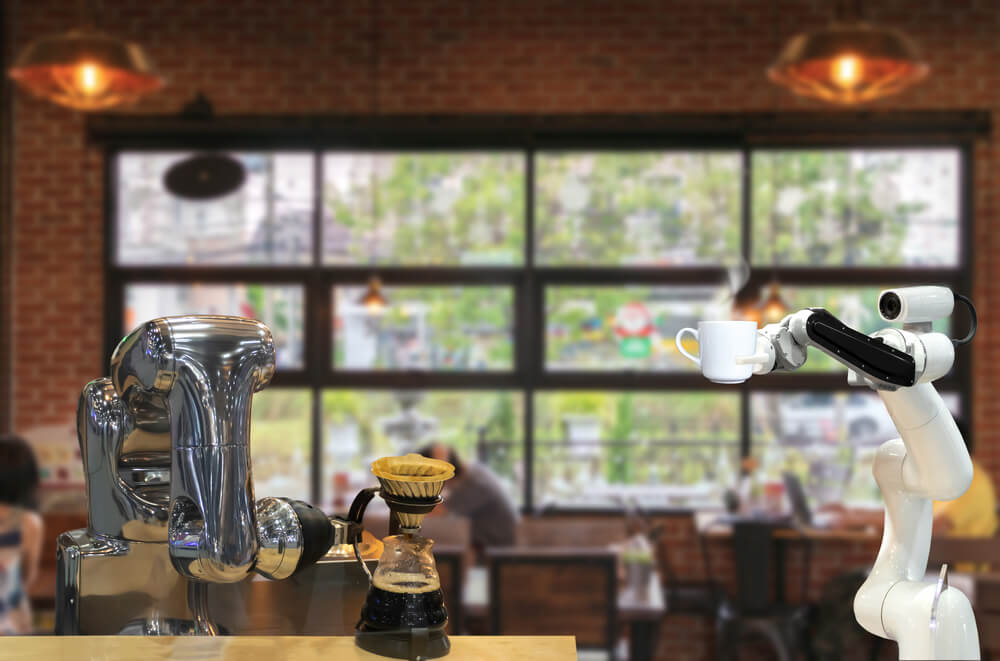 a coffee robot holding a cup of coffee