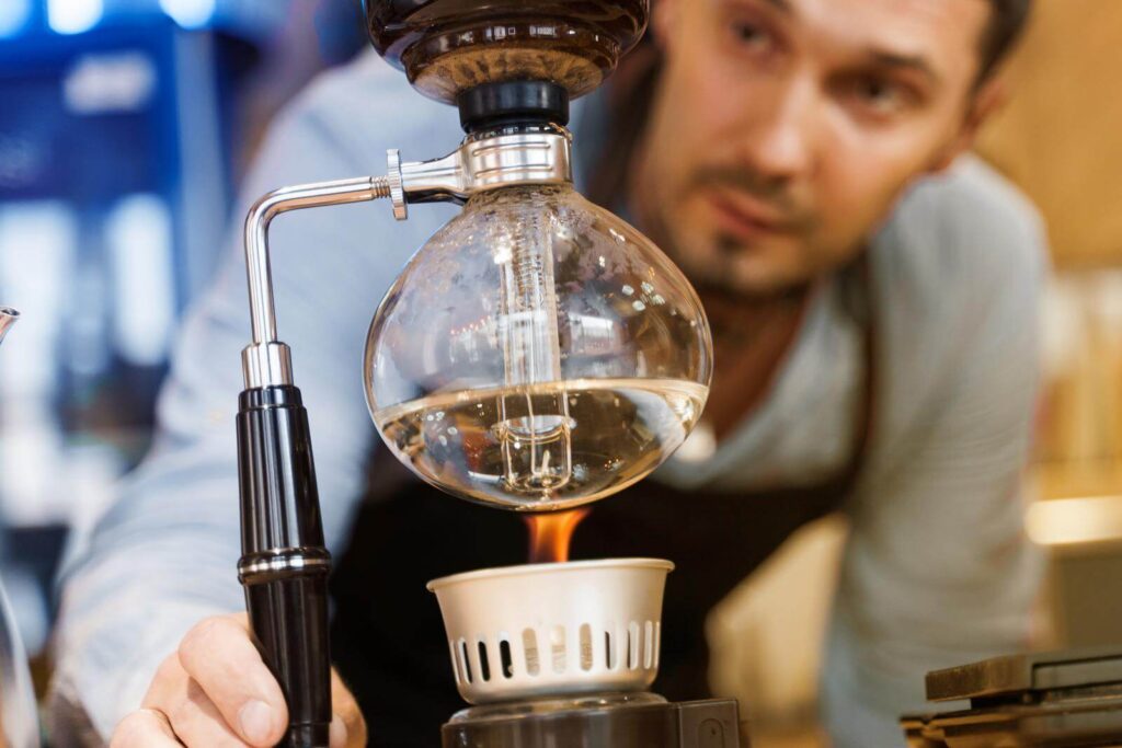 Barista looking at the brewing process 