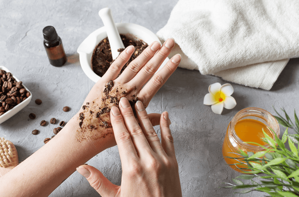 Woman rubbing coffee ground in her hand