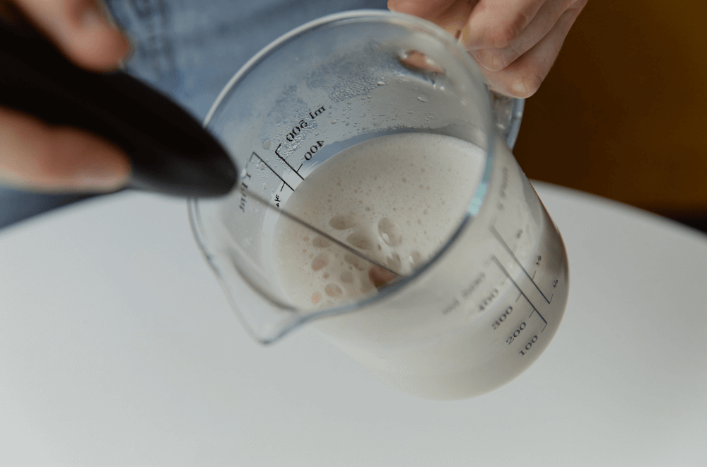 Frothed milk using a frother