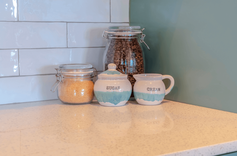 coffee beans in a jar with sugar and cream