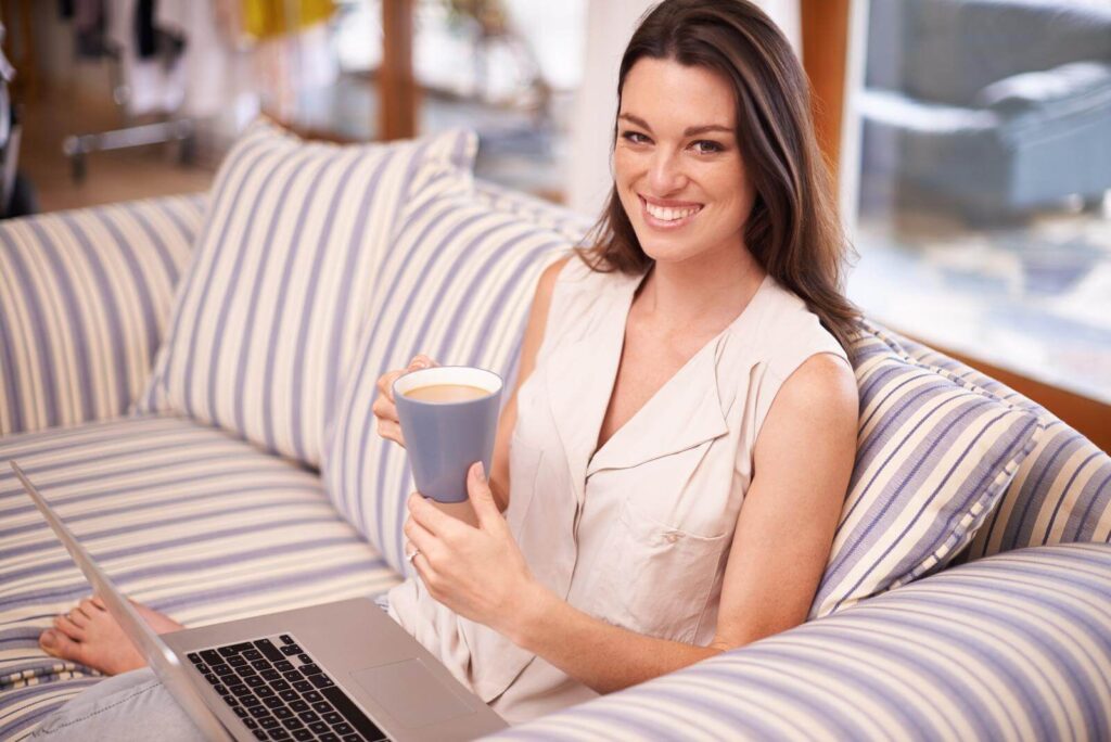 Portrait of an attractive young woman drinking coffee