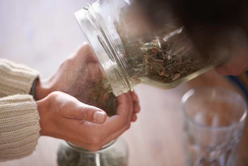 Putting tea leaves in a hand