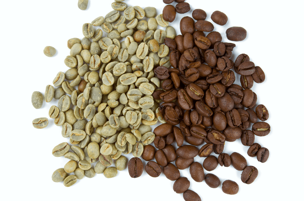 Green and brown coffee beans on white backgroud