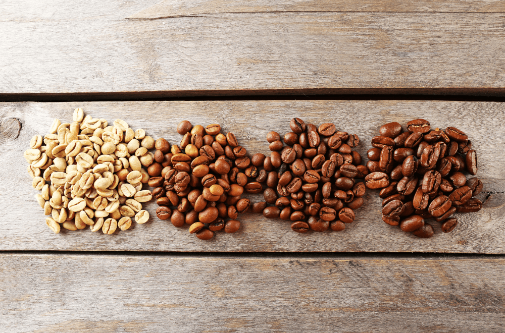 Variety of coffee beans on a wooden table