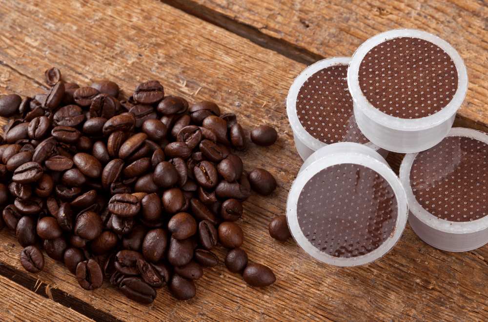 Coffee pods with beans in wooden table