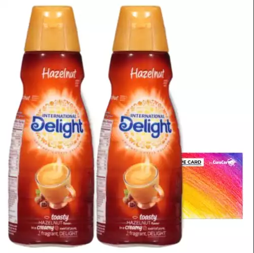 International-Delight Liquid Coffee Creamer.- Two (2) 32 fl oz Bottles Creamy Smoothly Delightful Coffee Creamer and One Authentic CureCor Collective Sticker! (Hazelnut)
