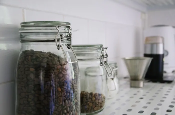 Coffee beans in sealed jars.