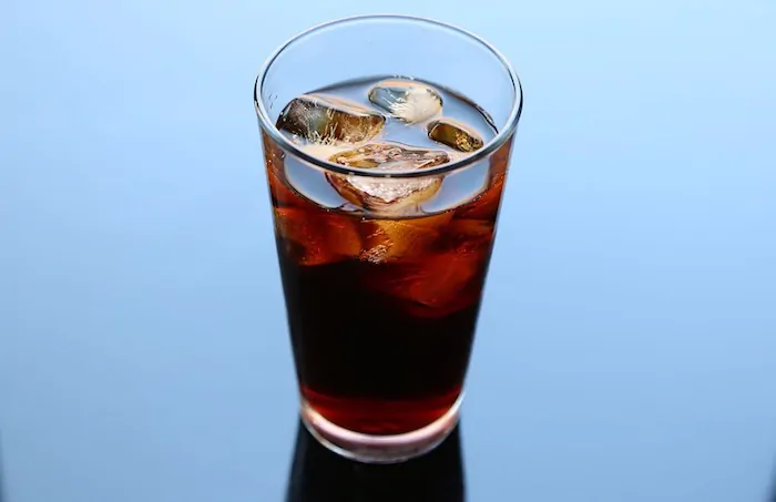 a glass of cold coffee brew - grind coffee beans for cold brewing