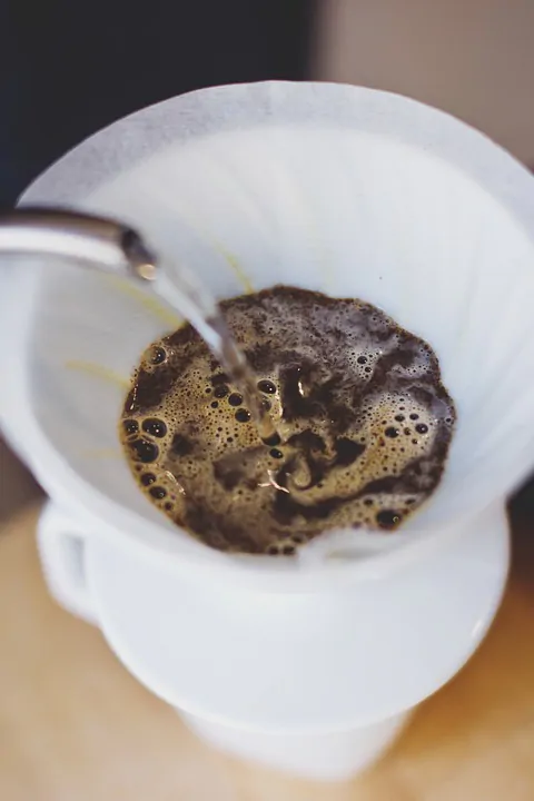 Coffee being poured into a cup.