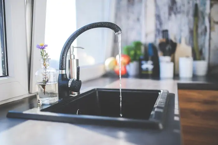 use tap water to make coffee - water flowing out a faucet