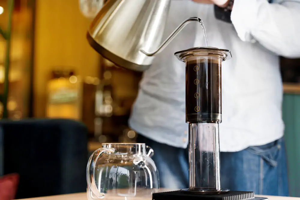 barista making coffee using Aeropress