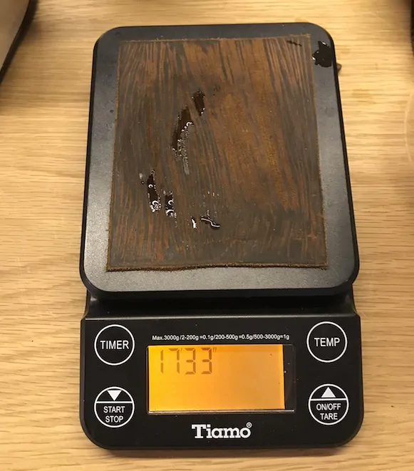 Electric scales on a table for weighing coffee.