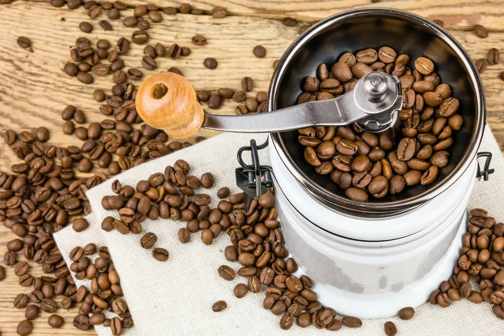coffee grinder with lots of coffee beans