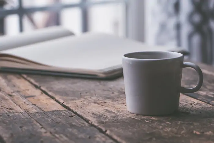 a white ceramic mug - bring coffee mug in my carry on