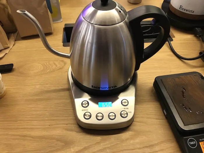 A coffee kettle on a table.