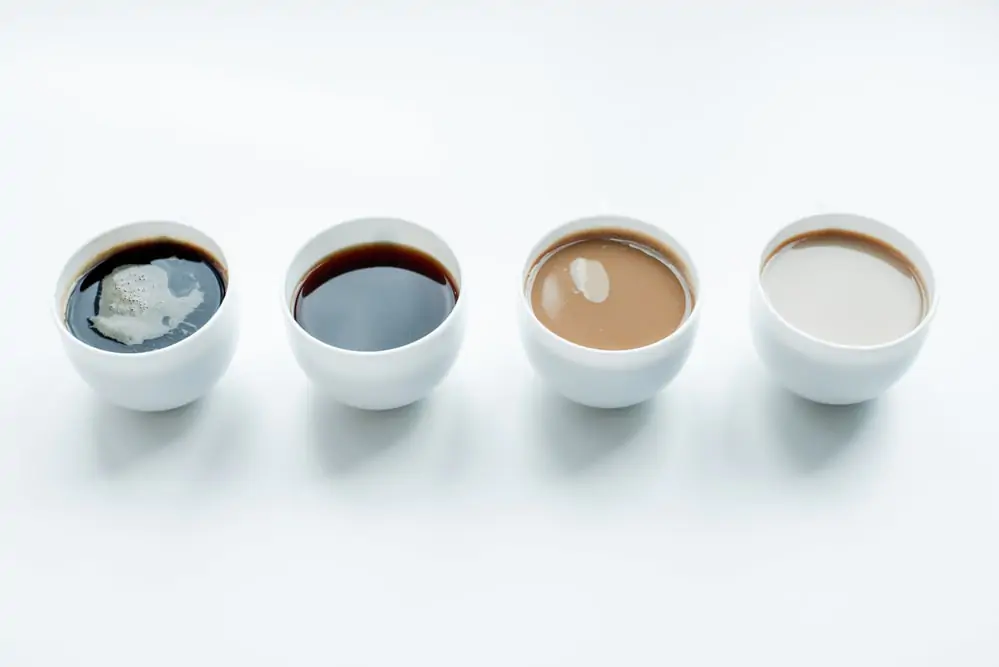 Multiple cups of americano coffee.