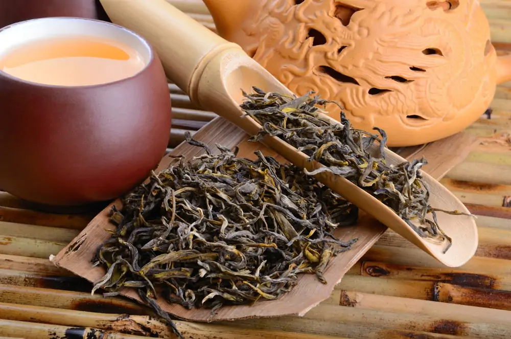 Oolong tea leaves on wooden table