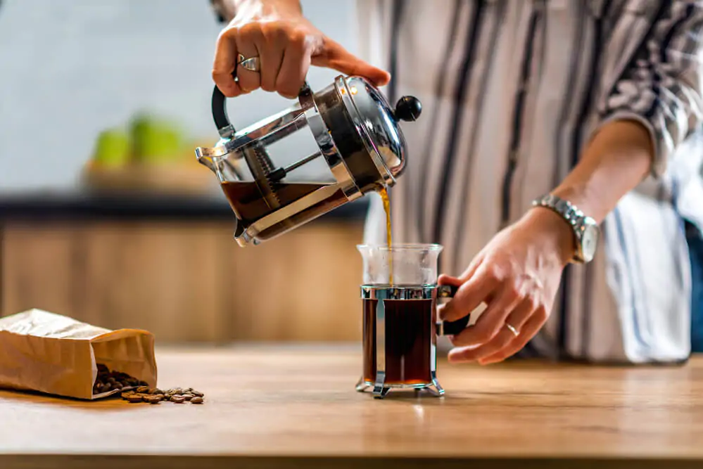 how long to steep coffee in french press - pouring coffee from a french press