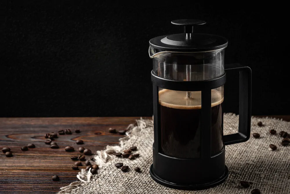 How Much Coffee For A French Press - french press coffee on a wooden table