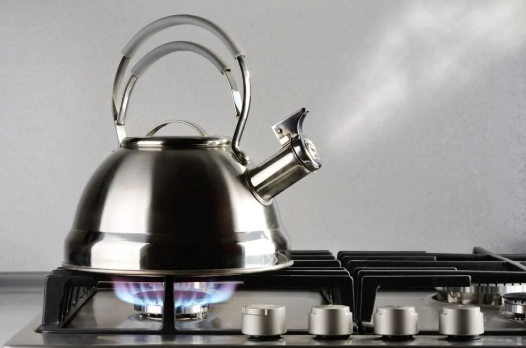 boiling water in the kitchen stove
