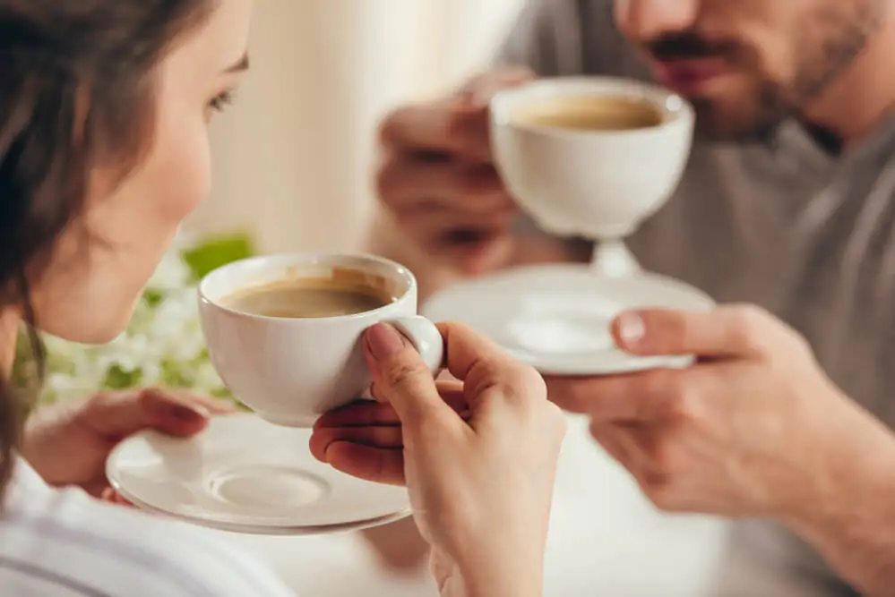 a couple enjoying their cup of coffee - what is decaf coffee