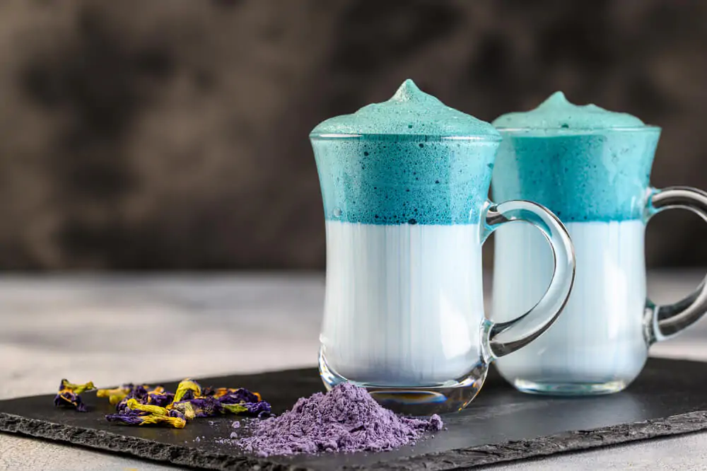 two cups of matcha dalgona blue latte