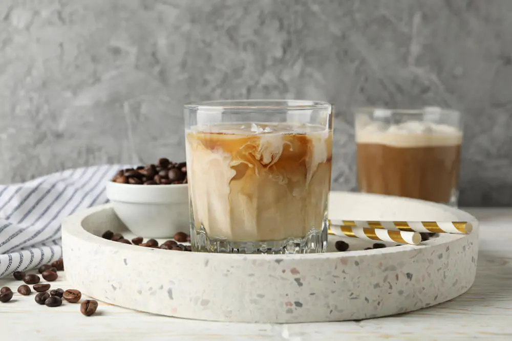 mocha iced coffee above a ceramic plate