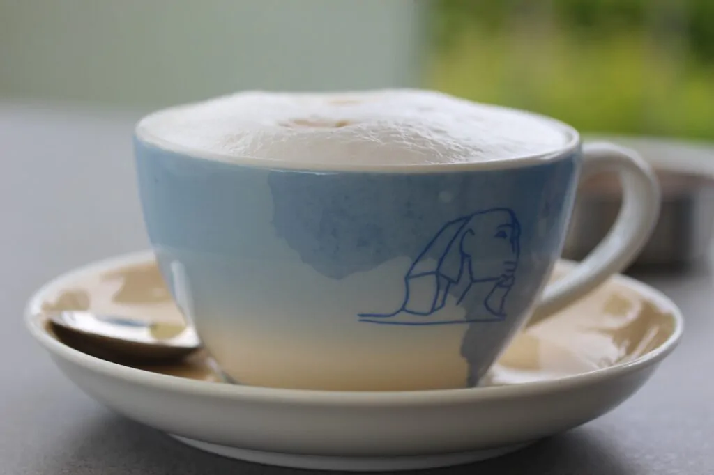 cup of macchiato with a high foam peak