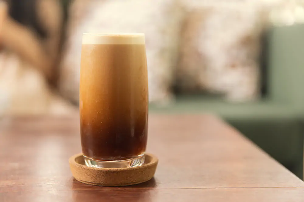 Nitro Coffee drink in the glass with bubble foam
