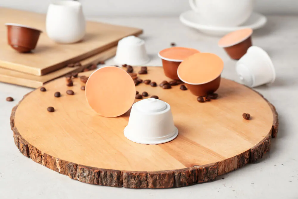 Plastic coffee pods with coffee beans