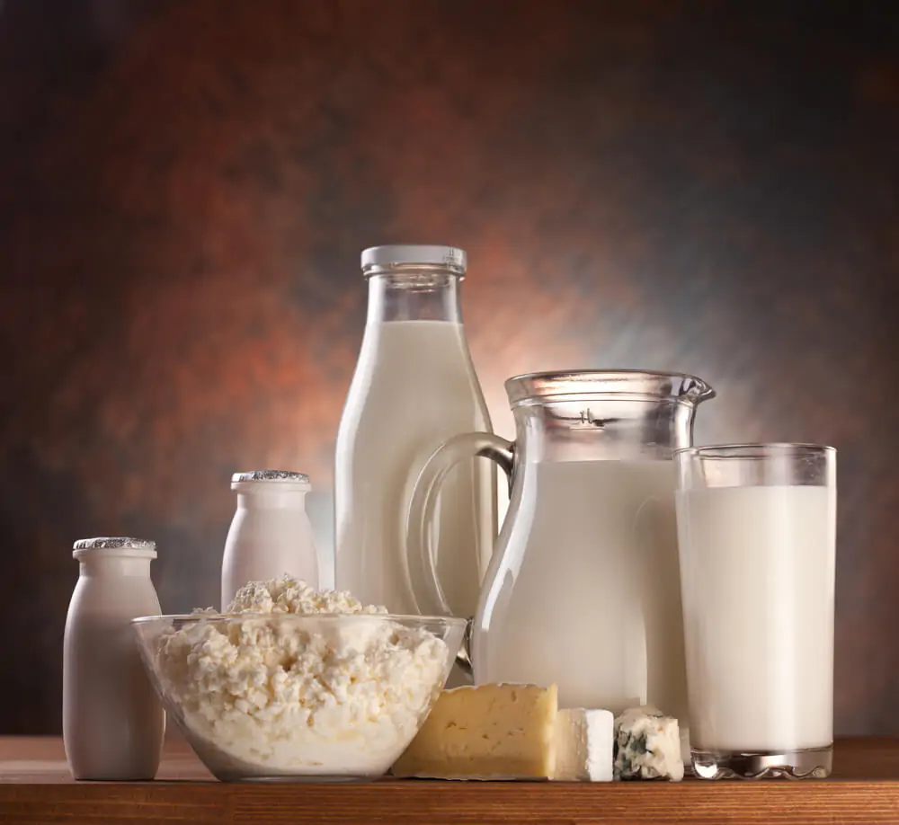 Which milk is best for frothing. Milk contained in different types of container with raw ingredients in front them
