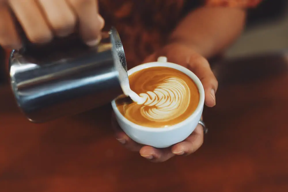 A man making art latte
