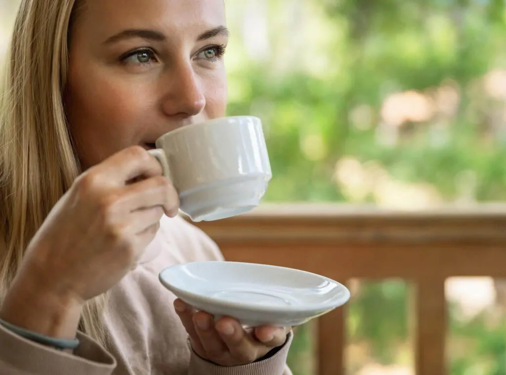 a woman drinking tea in the terrace