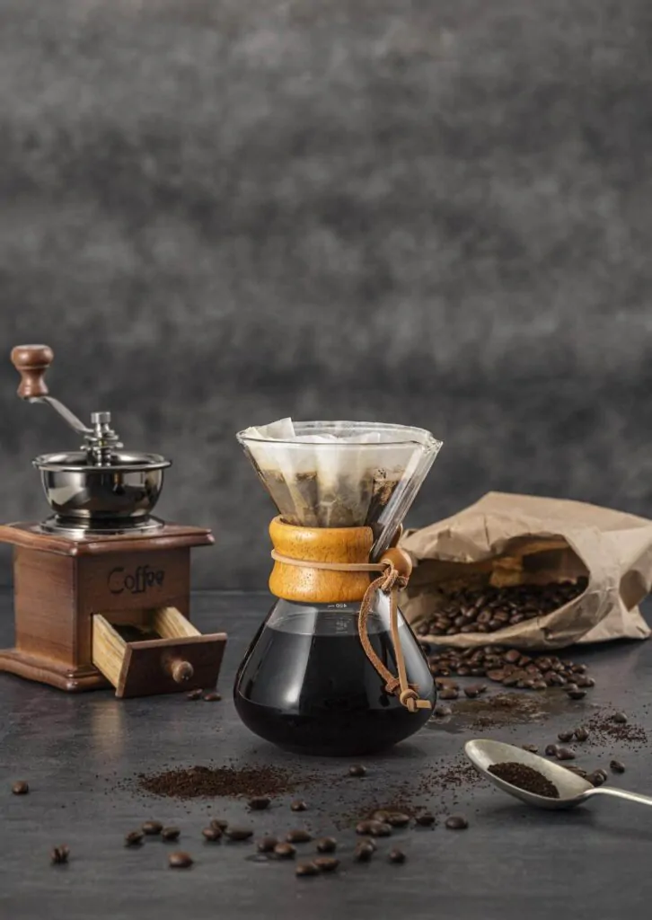 Chemex filter, coffee beans, and a spoon