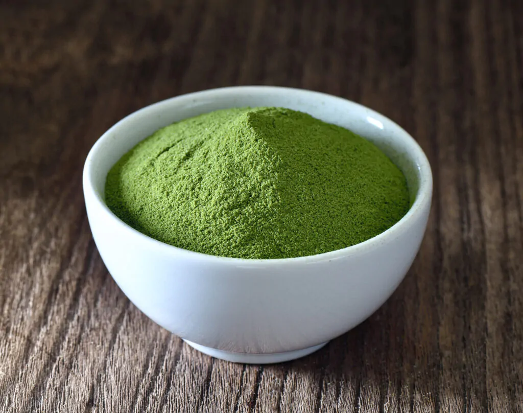 green tea leaves powder in a bowl