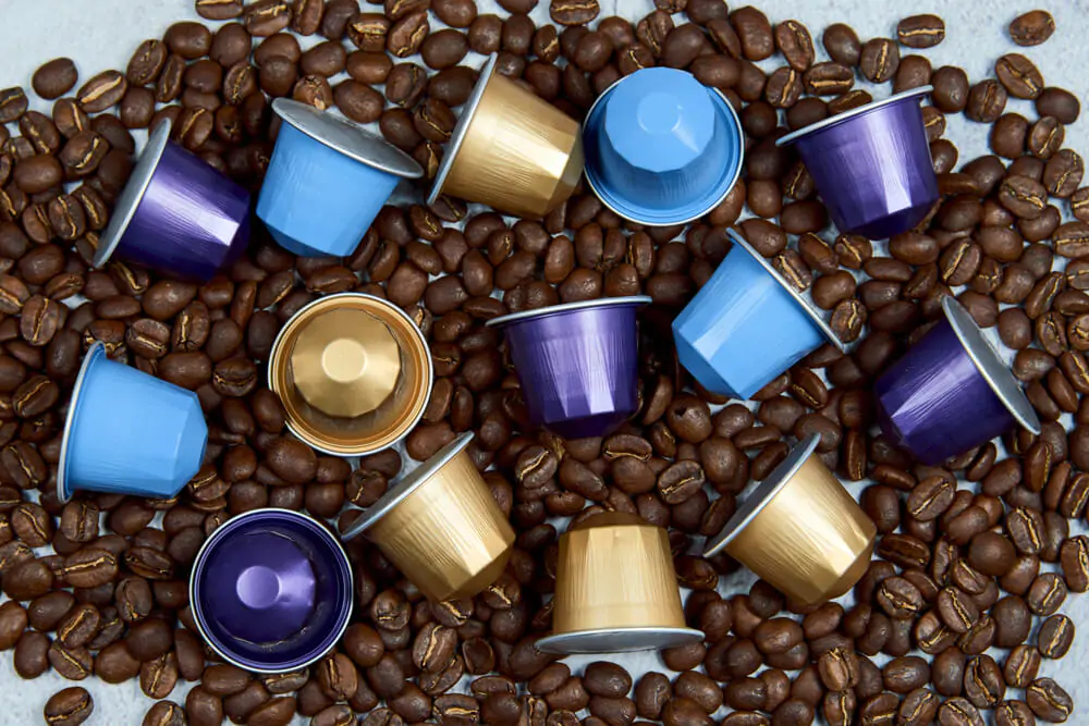 cups of Nespresso pods with coffee beans