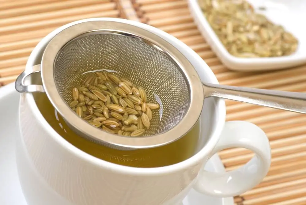 Fennel tee and seeds in a sieve