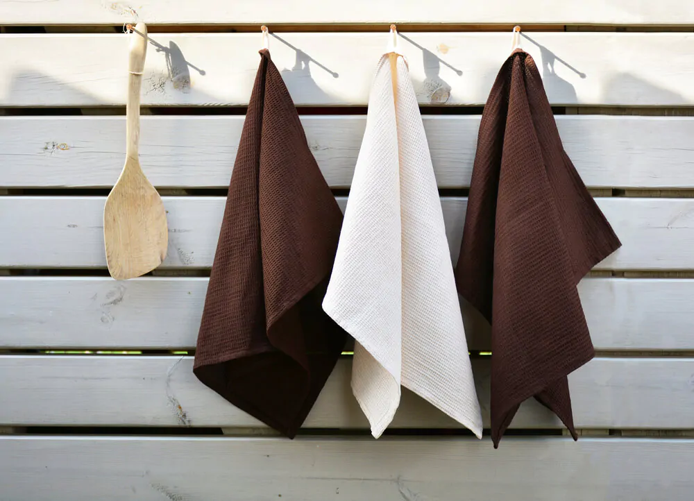 tea towels on a wooden frame