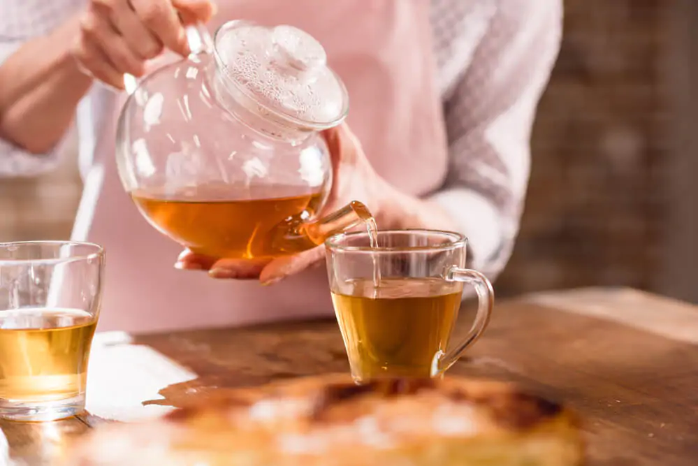 Pouring a newly brew Iaso tea - What is Iaso tea