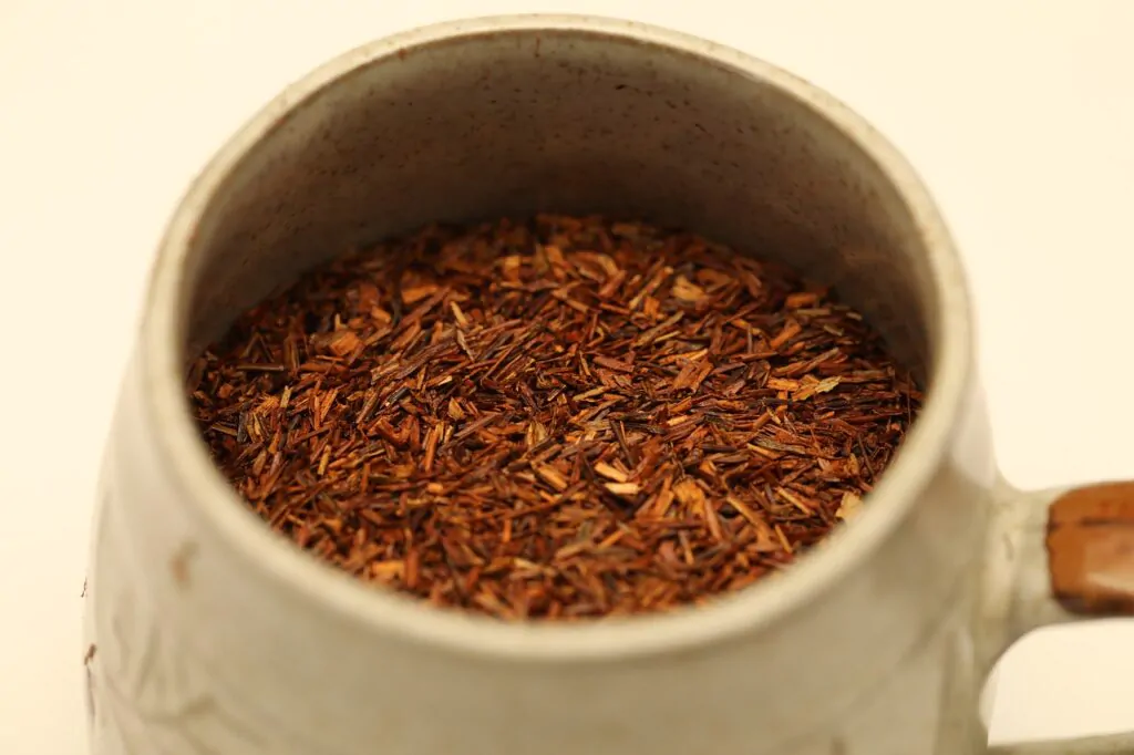 a cup of roiboos tea leaves