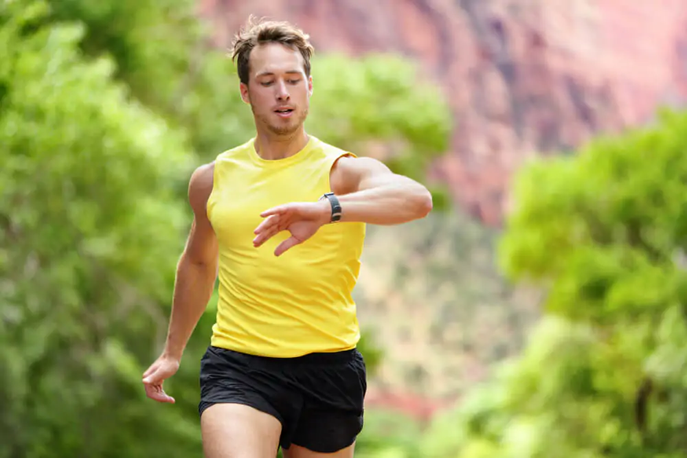 Man jogging outside - best teas for runners