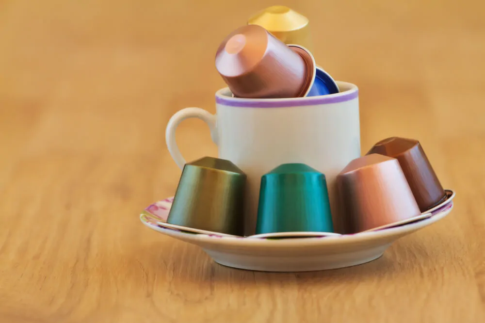  a cup of coffee with coffee capsules