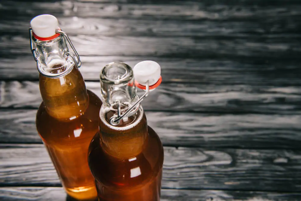 fermented tea in glass bottles with sunlight - what kind of alcohol is in flying embers