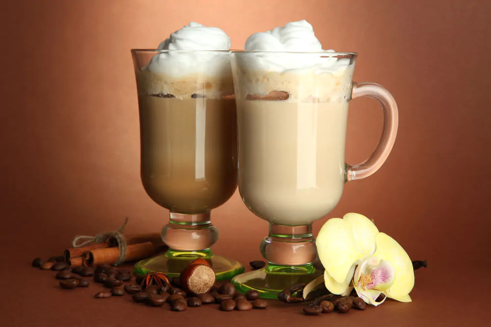 twp cups of vanilla coffee with creamy cheese toppings