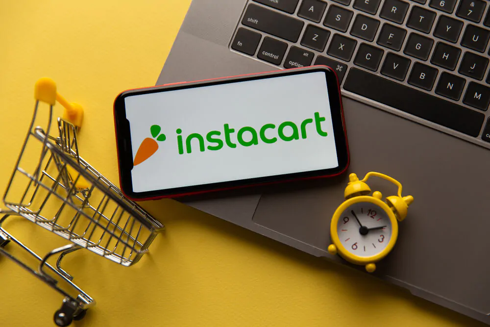instacart app with a clock and a mini cart 