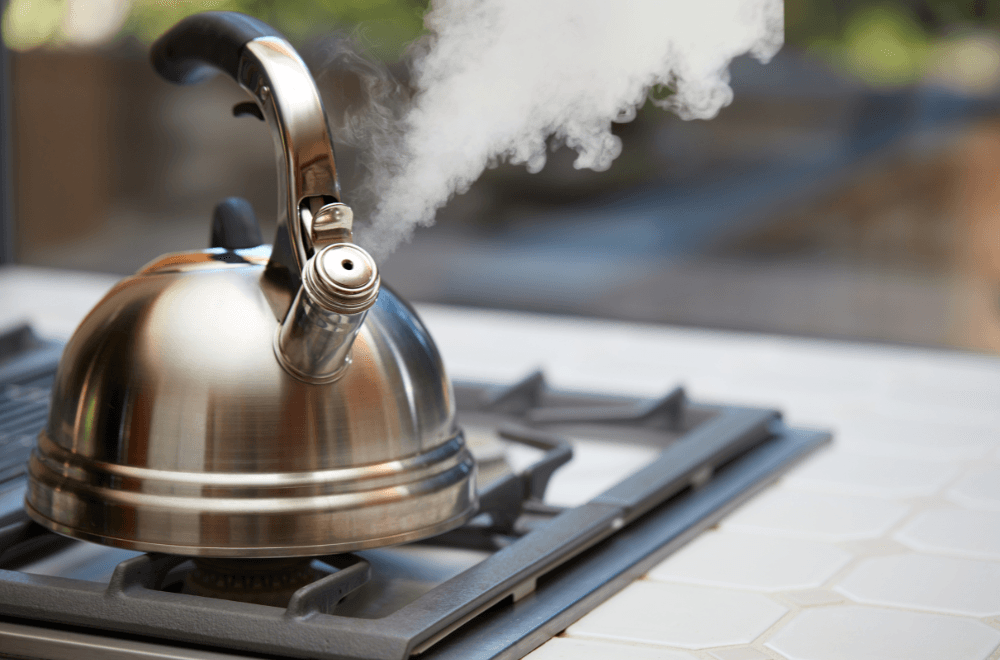 Kettle in stove blowing smoke